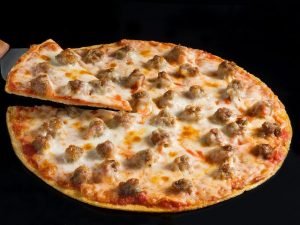 11110326-Thin-Crust-Sausage-Pizza-on-a-Black-Background-with-a-Slice-on-a-Spatula.jpg 11110326-Thin-Crust-Sausage-Pizza-on-a-Black-Background-with-a-Slice-on-a-Spatula.jpg